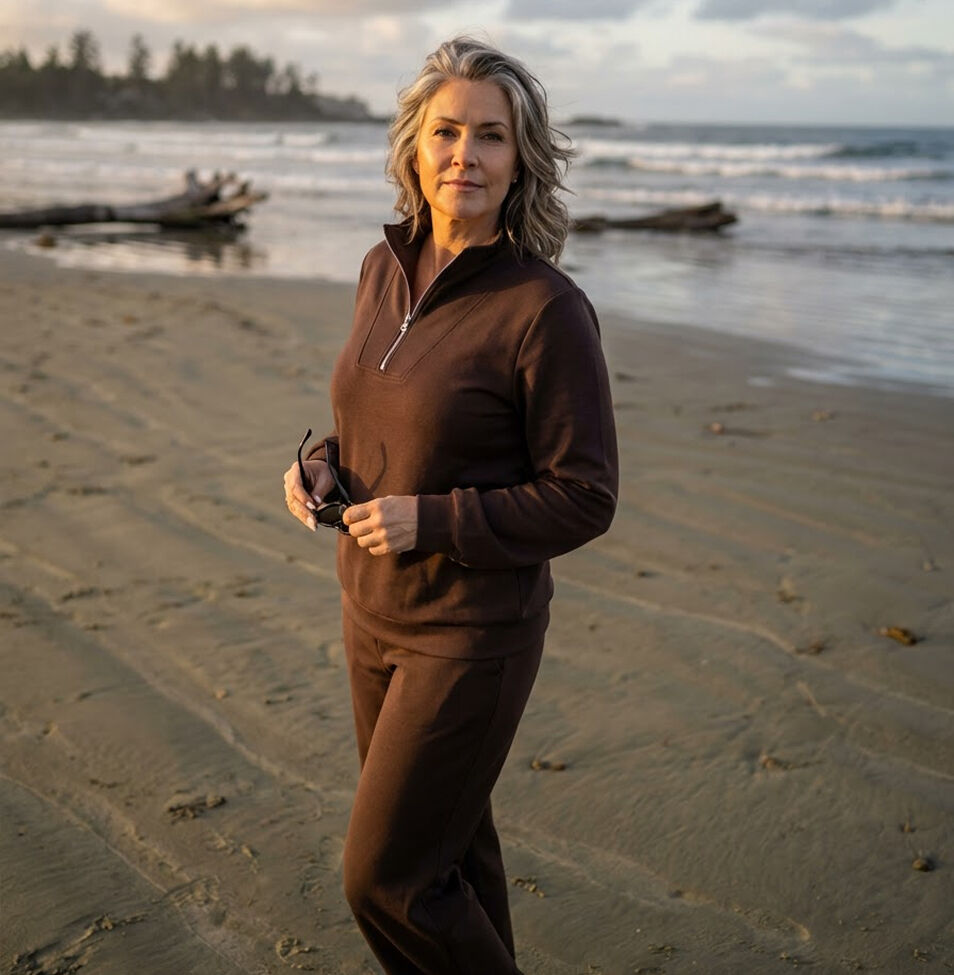 Tofino beach woman wearing brown quarter zip sweater